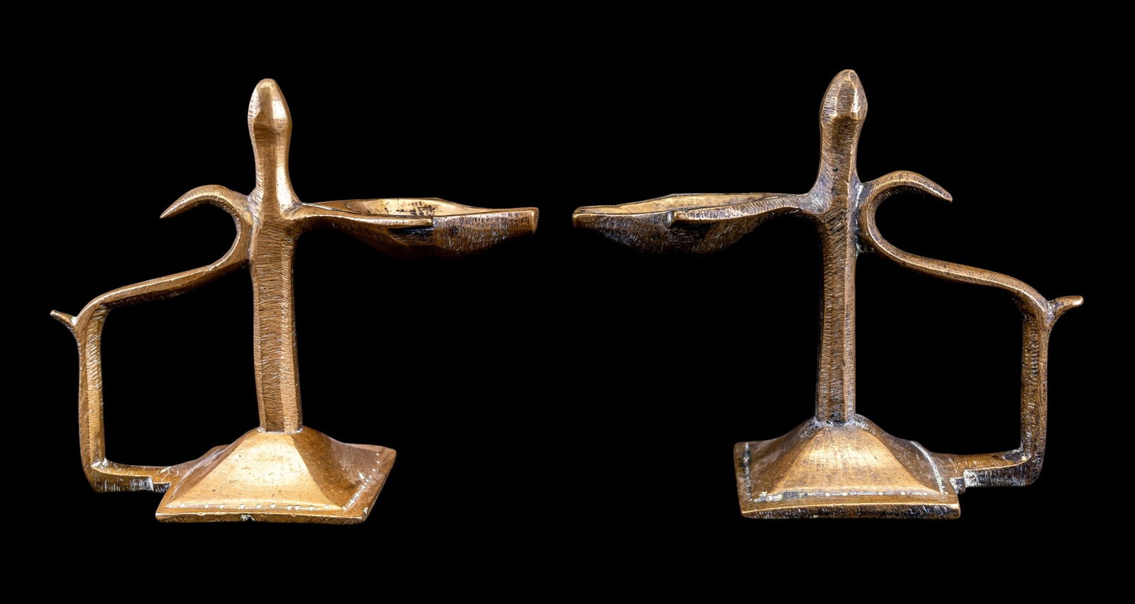 Pair of Vintage Indian Brass Aarti Diya Lamps: Pair of traditional Indian vintage brass handheld aarti lamps, each with a single spoon-shaped oil receptacle with pointed wick rest, raised central pillar, and curved open handle. Each measures appro
