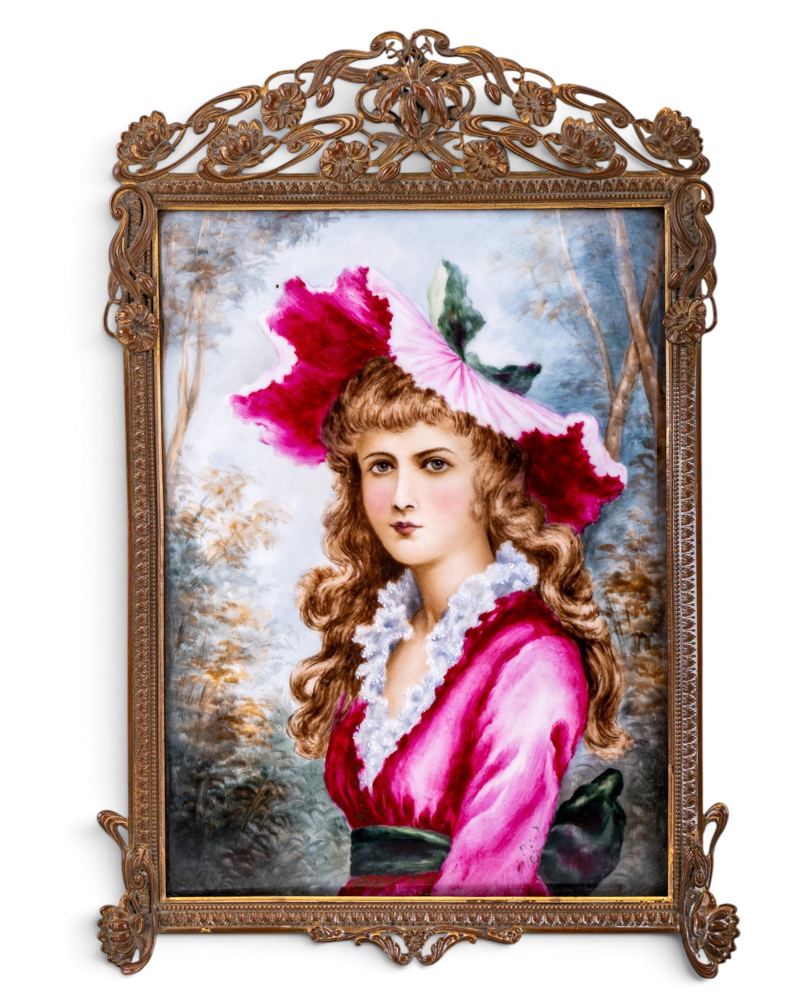 19th C Painted Porcelain Plaque in Bronze Frame: A 19th C hand painted porcelain plaque depicting a young woman in a dark pink dress and hat displayed in an Art Nouveau floral bronze frame with easel back. Total piece measures approx. 13" H x 8.5"