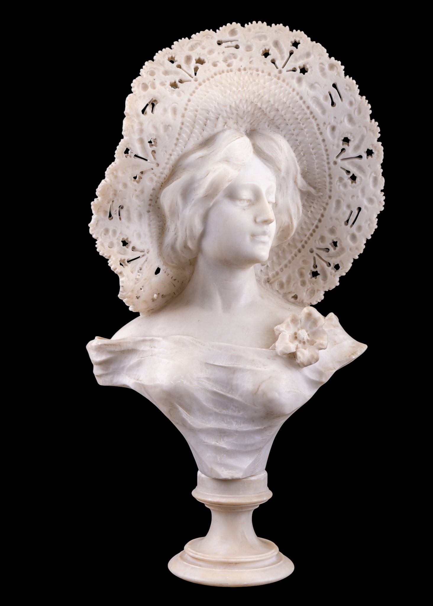 A. Cipriani (ITL 1857-1941) Carved Alabaster Bust: A finely carved labaster bust on detachble base depicting a young woman wearing a pierced brim sun hat, featuring a flower corsage. Signed on the lower back section by Adolfo Cipriani (Italian
