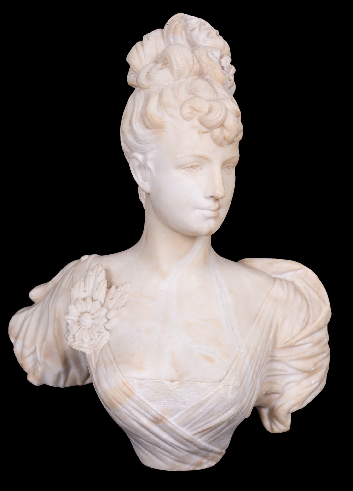 19th C Alabaster Bust of Young Woman: A 19th C carved alabaster head and shoulder bust depicting a young woman with a flower corsage, note some restorations, there is no base, measures approx. 14" H.