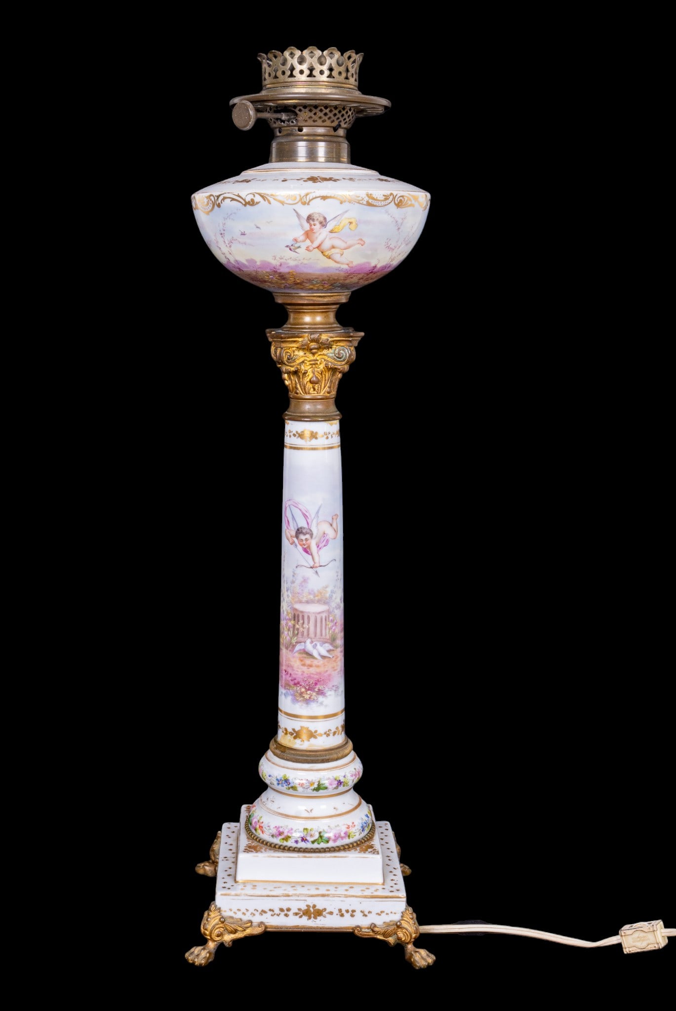 19th C French Hand Painted Oil Lamp Conversion: A 19th French hand painted porcelain oil lamp conversion depicting garden scene, featuring ormolu claw feet and ornate collar, measures approx. 26" H to the socket.