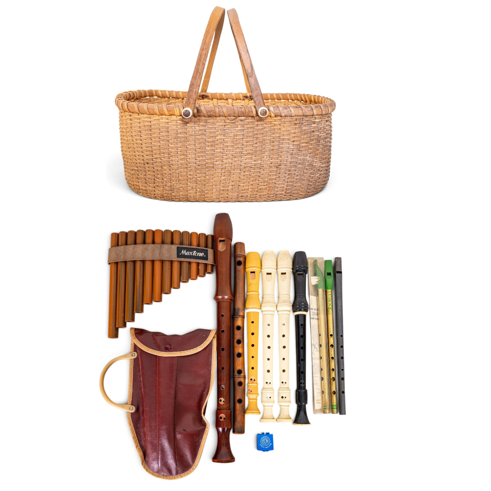 Vintage Recorders, Irish Whistles, and More: A collection of vintage recorders of various materials featuring white and black plastic by manufacturers such as Trophy Music, wooden recorders by Roessler and Schreiber, a bamboo flute, pan flute,