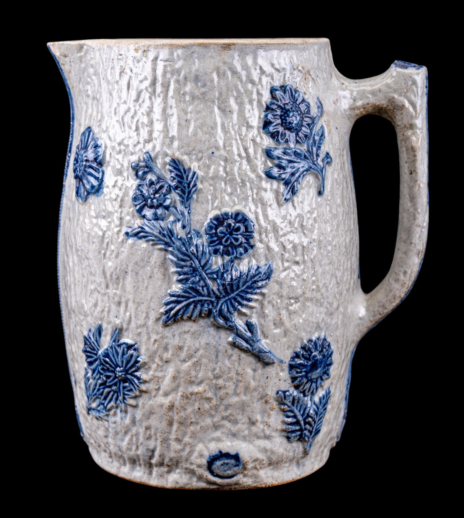 19th C White's Pottery Salt Glazed Pitcher: A 19th C salt glazed stoneware handled pitcher by White's Pottery of Utica, NY, note significant cracks, measures approx. 9" H.