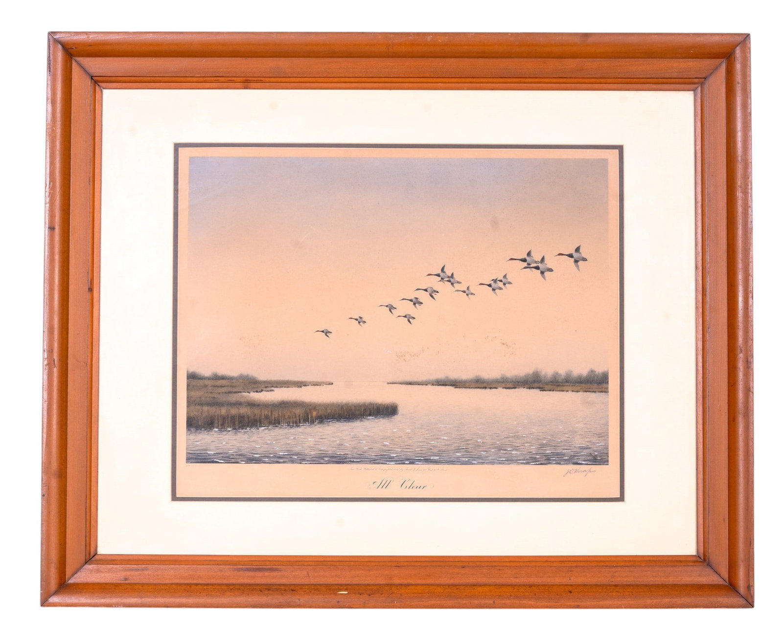 'All Clear' Print after J.D. Knap (AM 1875-1962): A framed print depicting body of water with reeds featuring ducks flying overhead, titled 'All Clear', pencil signed in the lower right corner by Joseph Day Knap (American 1875-1962), edition No. 129