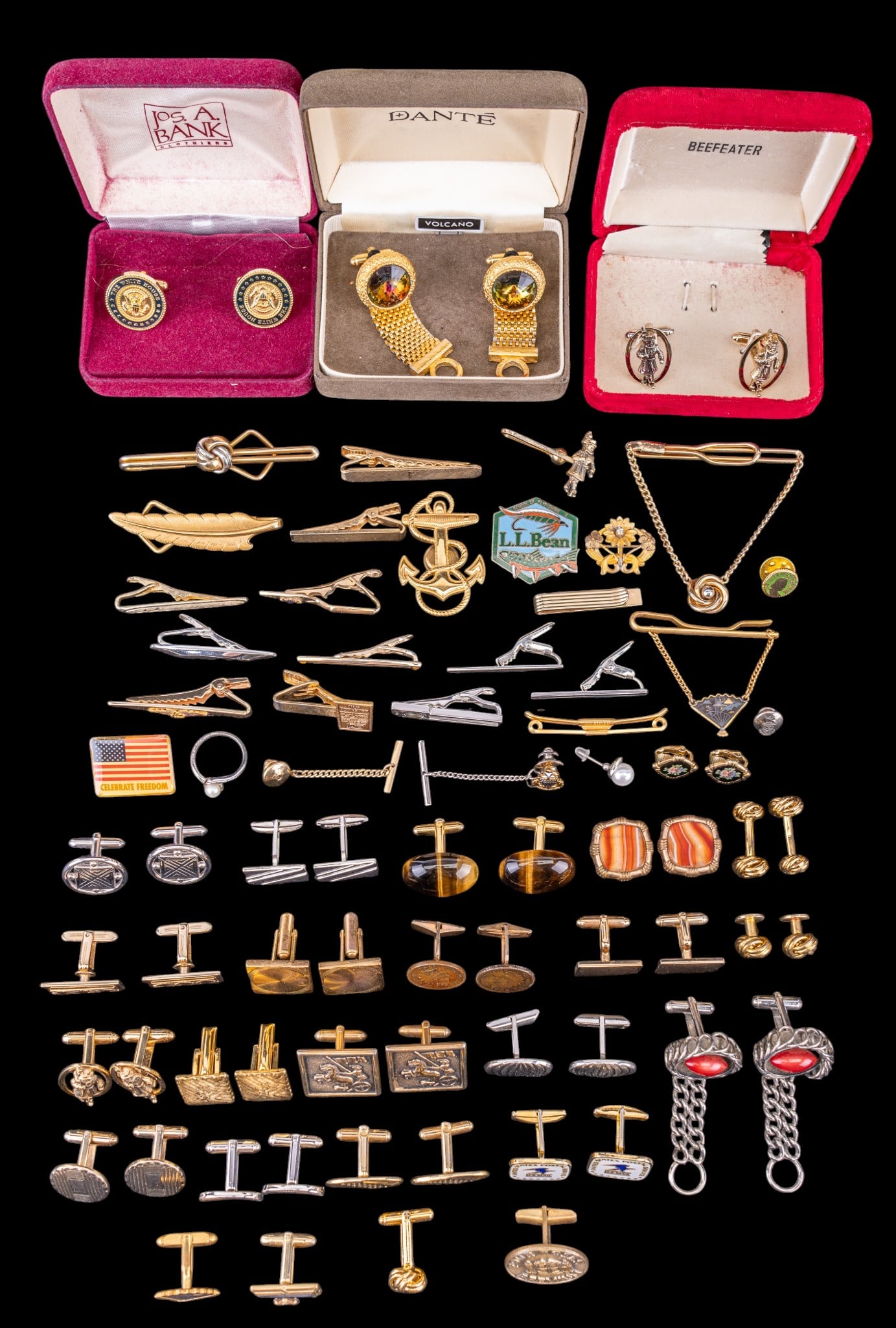 Cufflinks, Tie Bars, and More: A collection of vintage tie bars, cufflinks, and pins including a pair of White House cufflinks, and brands such as Beefeater, Swank, Dante, and more.