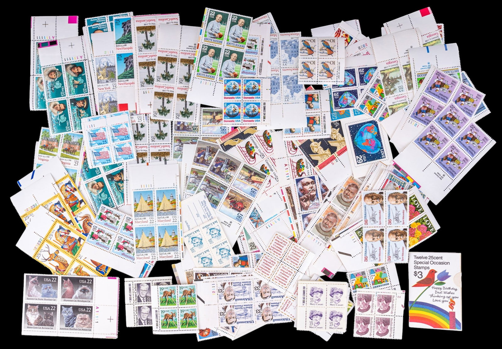 Collectible U.S. Postage Stamps: A alrge assortment of collectible U.S. postage stamps in 4-square sheets including denominations such as 3 cents,15 cents, 19 cents, 22 cents, 25 cents, 29 cents, 33 cents, and 45 cents.