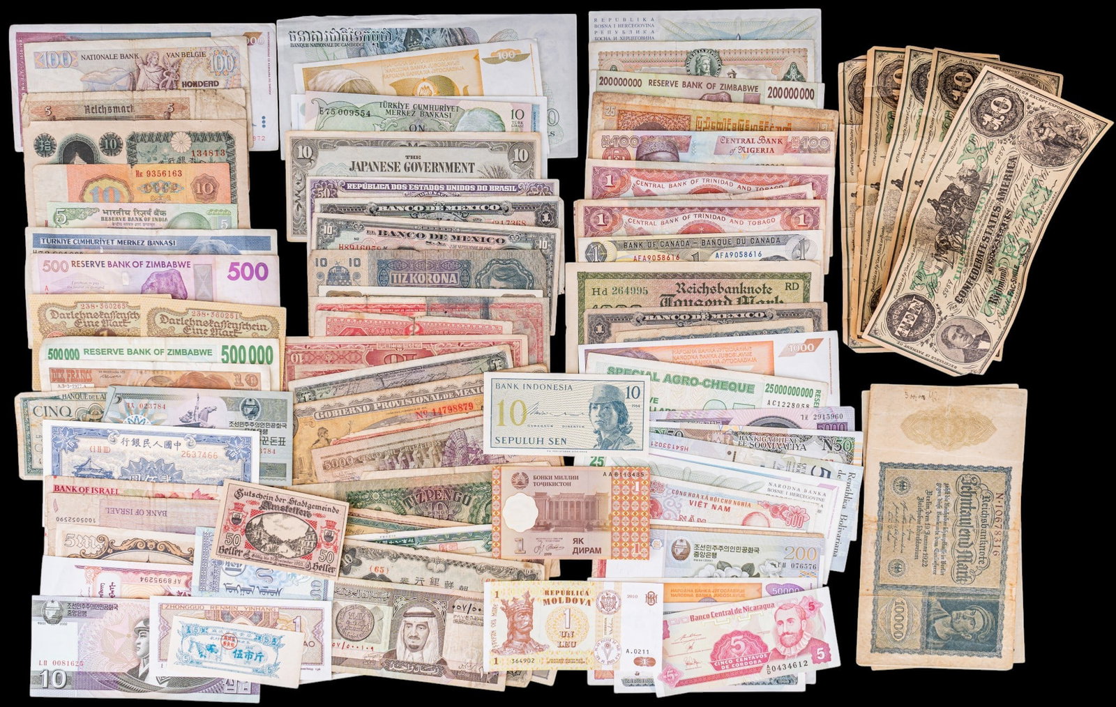 International Paper Currency: A large collection of international paper currency including countries such as Zimbabwe, Indonesia, North Korea, Mongolian, pre WWII Germany, Israel, Soviet Union, Algeria, China, Yugoslavia, Turkey,