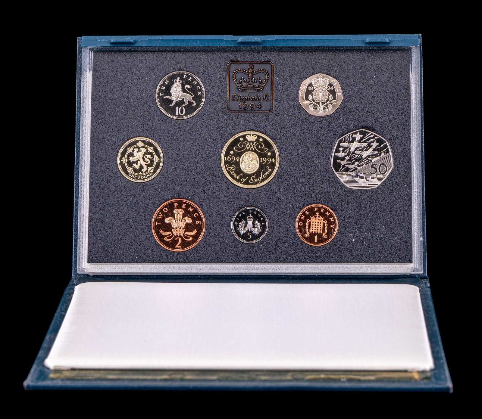 1994 United Kingdom Royal Mint Proof Coin Set: Official 1994 United Kingdom Royal Mint proof coin collection housed in original presentation case with card. Includes eight proof coins and Bank of England medal.