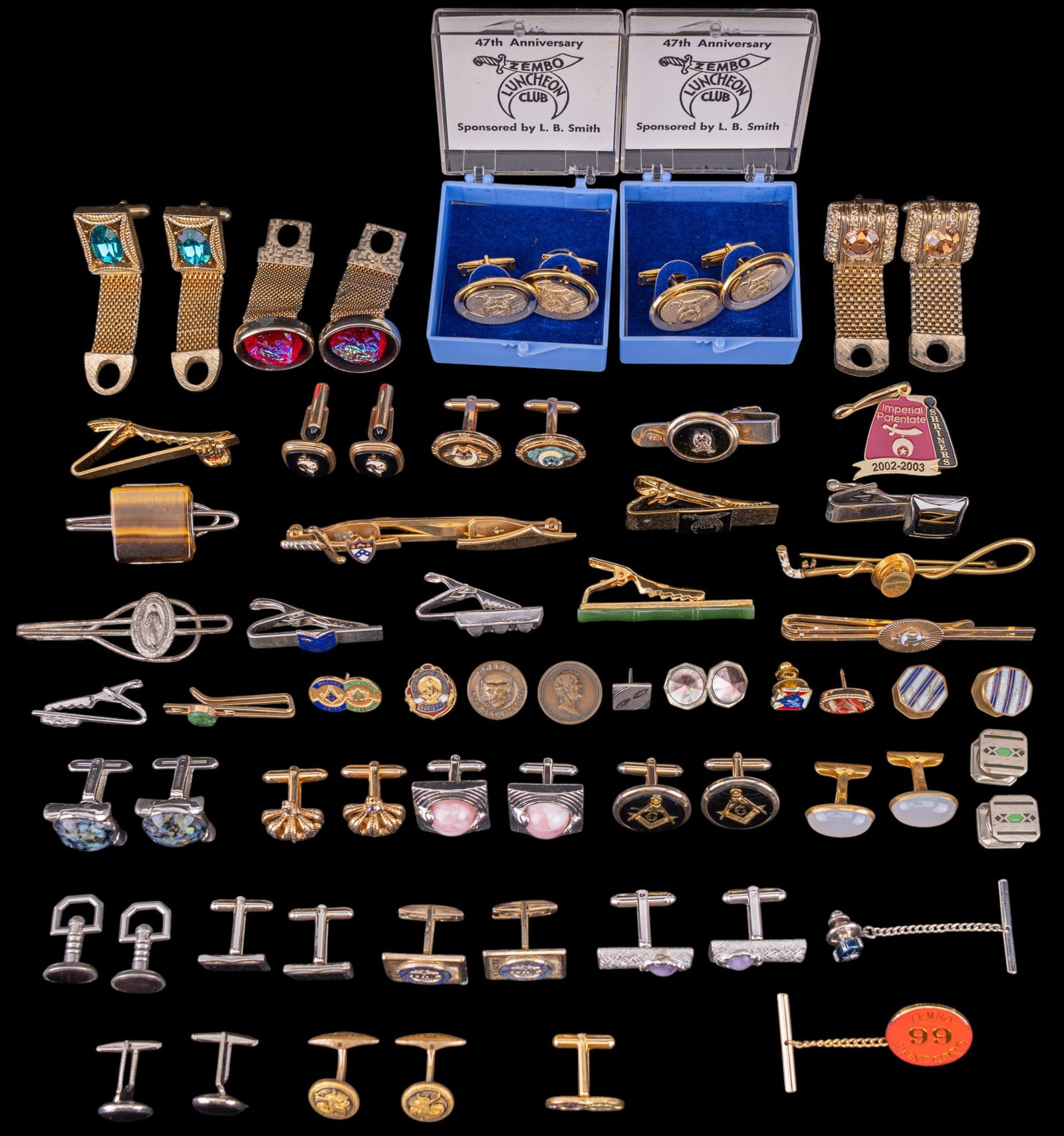 Vintage Cufflinks and Tie Clips: A large assortment of vintage cufflinks and tie clips, tie pins, enamel lapel pins, featuring Shriners and designes by Swank and others.