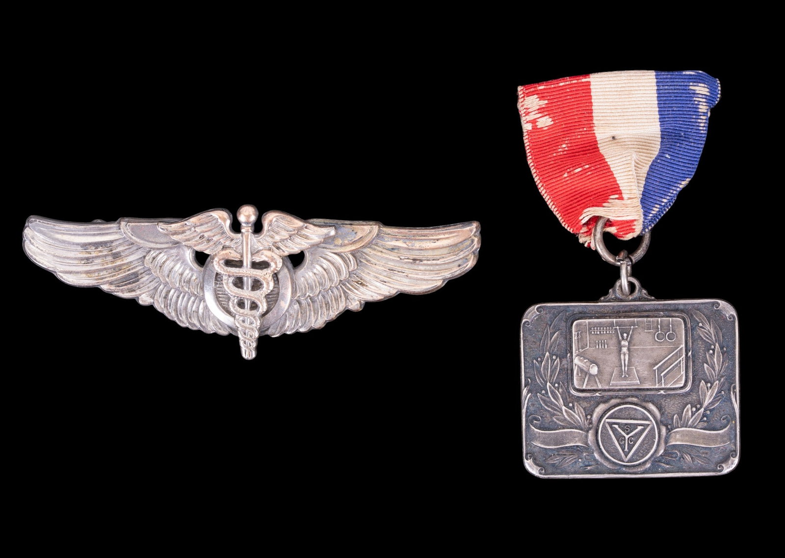Sterling Medal and US Military Insignia: A collection of sterling items including a US Air Force Flight Surgeon wing badge and a sterling gymnastics medal c. 1927. Total weight is approx. 1.65oz.