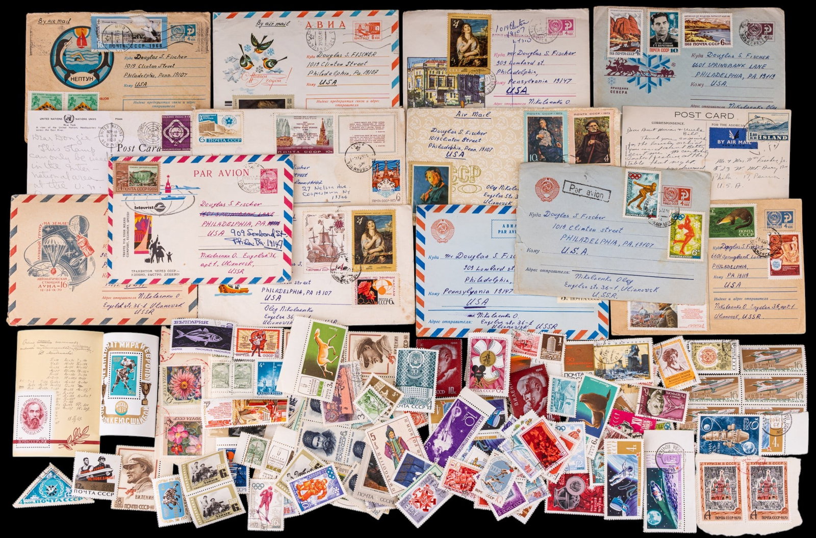 Soviet Era Russian Postage: A large collection of Soviet era Russian postage including loose stamps, canceled stamps, post cards, and some block sheets.