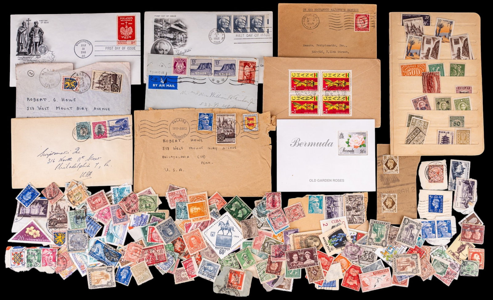 Vintage International Postage: A large collection of vintage international postage including loose and canceled postage, first day use, and pre-stamped envelopes.
