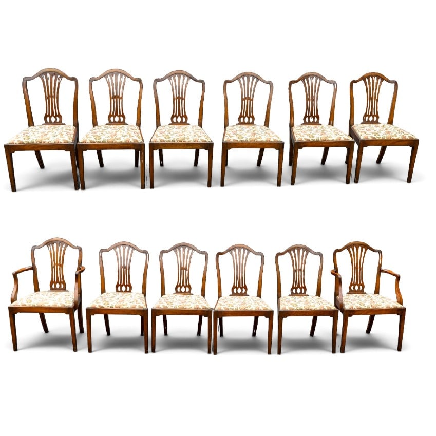 Set of 12 Mahogany Dining Chairs: Set of 12 mahogany dining chairs with removable, floral upholstered seats. Set comprises 10 side chairs and 2 arm chairs. One side chair with loss/repair to back rail. Each arm chair measures approx.