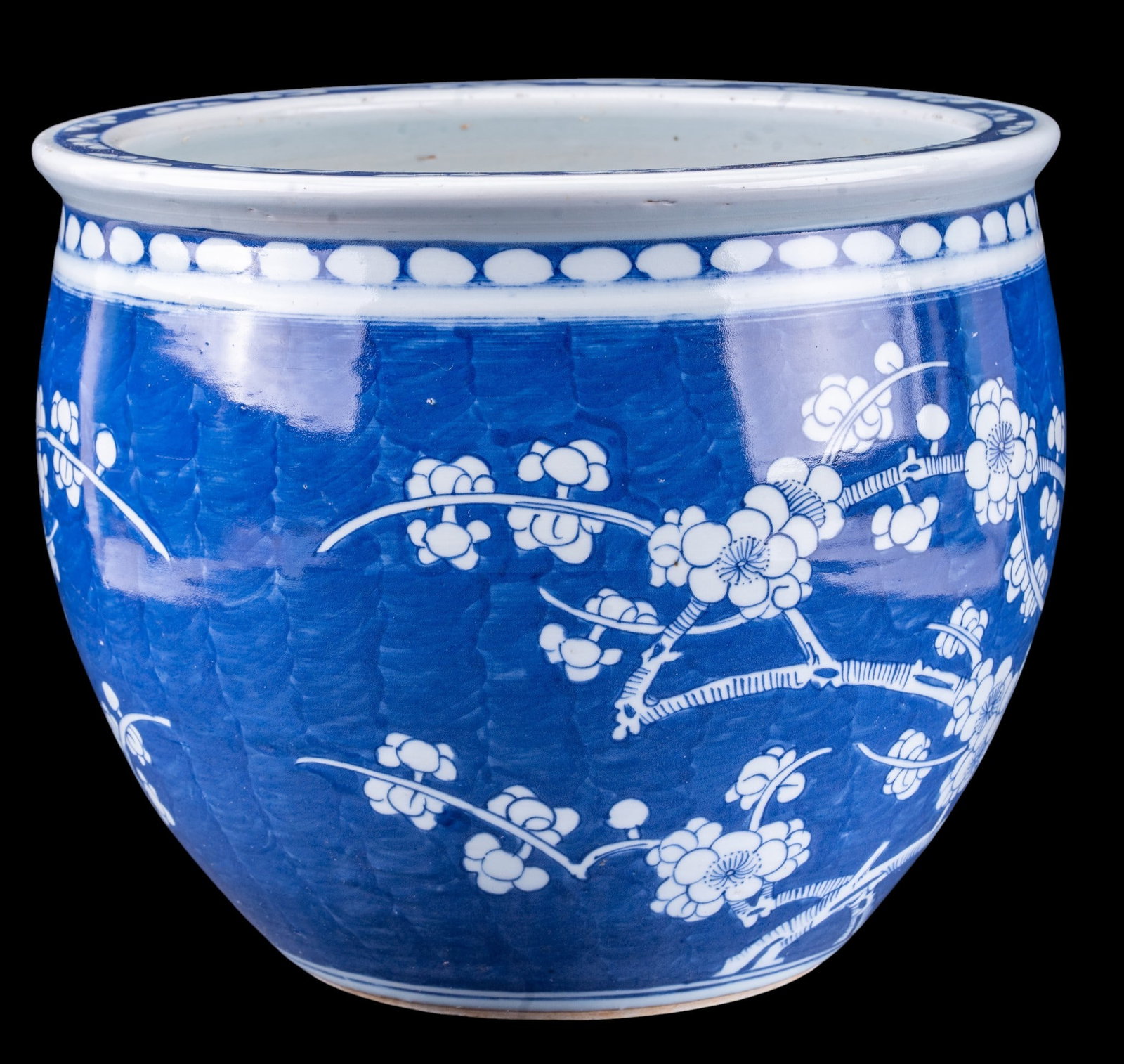 Chinese Blue and White Porcelain Ice Plum Planter: A Chinese blue and white porcelain koi planter featuring an 'ice plum' design, measures approx. 12" diam x 10" H. From the Estate of Carol and George Thomassy, Hanover, PA.