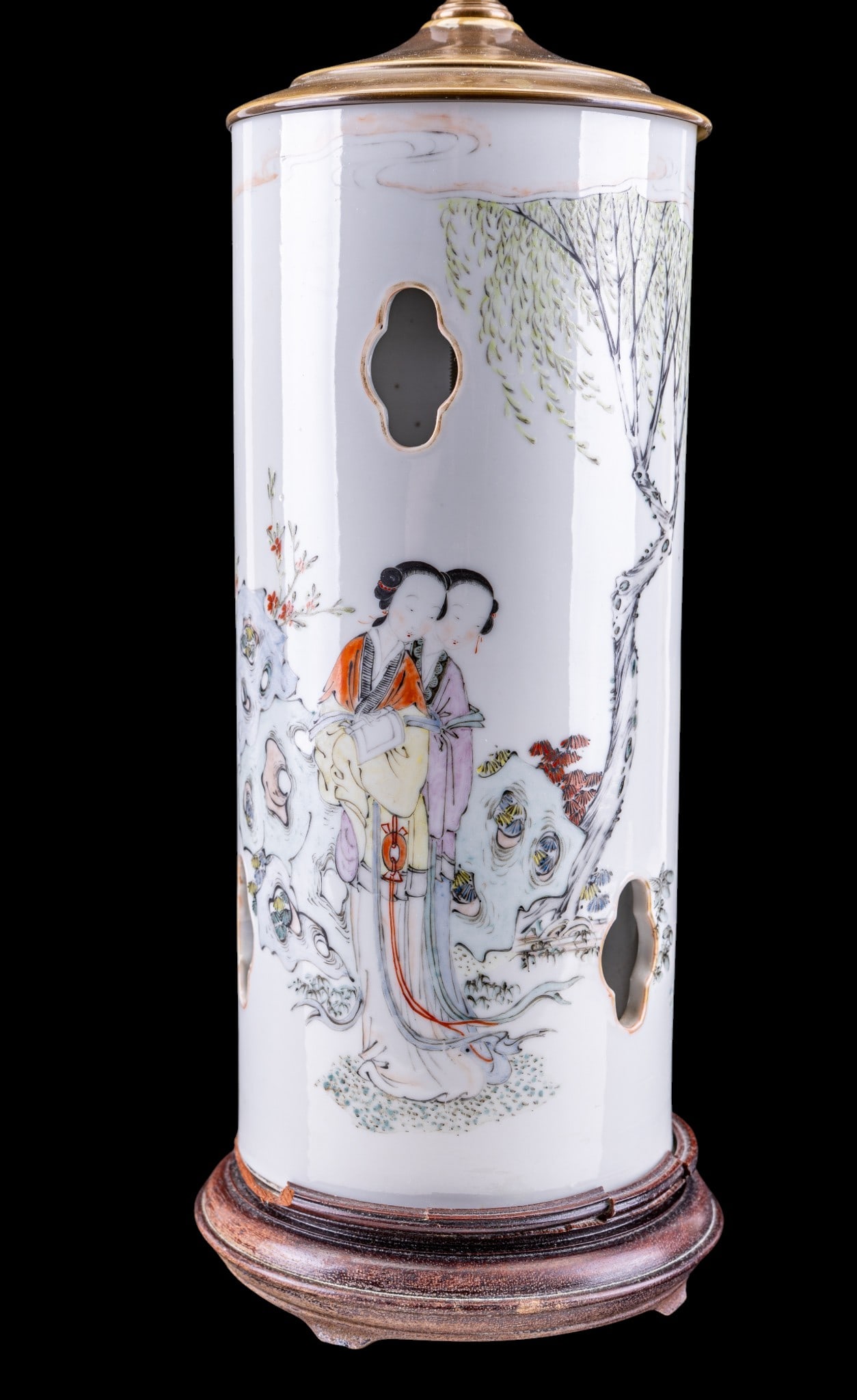 Chinese Republic Porcelain Famille Rose Lamp: A Chinese Republic Famille Rose porcelain lamp featuring a jade finial and depicting ladies in a garden, measures approx. 18" to the socket, 28" H to the finial. Note some loss to wooden base. From th