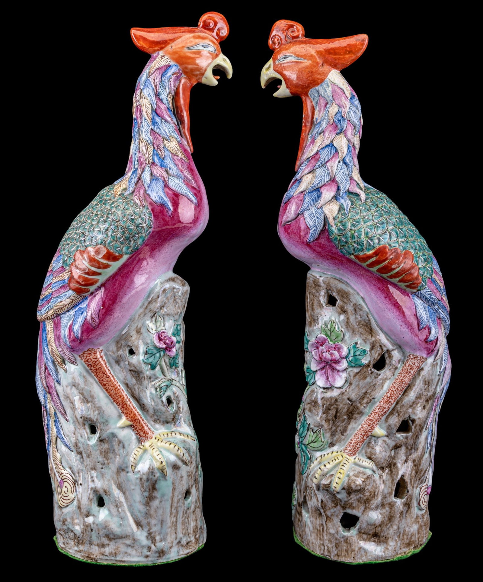 Chinese Fenghuang Porcelain Phoenix Statuettes: A pair of hand decorated Chinese porcelain Famille Rose Fenghuang phoenix statuettes, both measure approx. 18" H. Note felted bottom. From the Estate of Carol and George Thomassy, Hanover, PA.