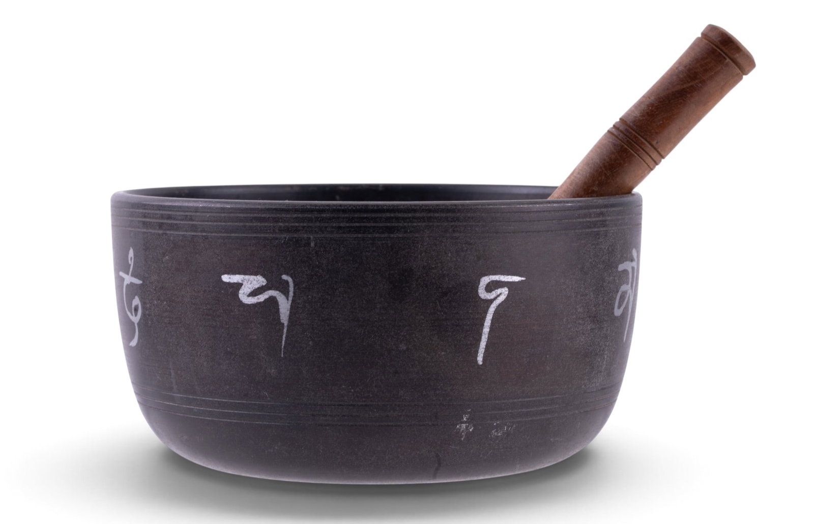 Tibetan Singing Bowl: A bronze Tibetan singing bowl featuring a relief image of Green Tara at the bottom of the bowl, hand painted characters around the outside of the bowl, and a turned wood and suede wrapped puja mallet.