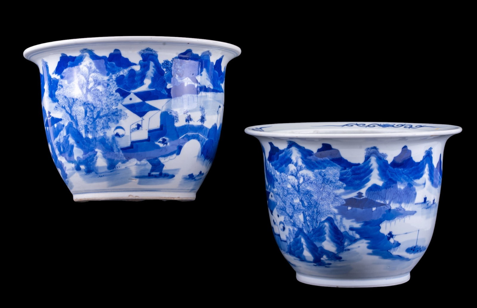 Chinese Blue & White Porcelain Jardiniere Pair: Pair of Chinese blue and white porcelain jardiniere planters. Each features continuous, hand-painted "Shanshui" (mountain-water) panoramic coastal landscape. Exterior artwork dynamically depicts tradi