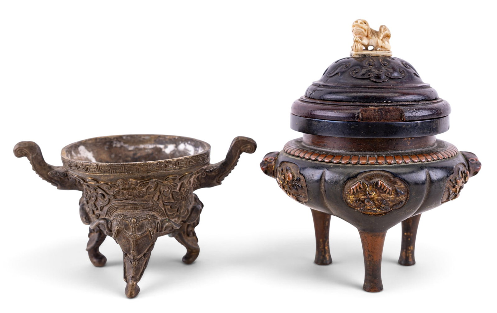 Chinese Bronze Tripod Censers, Foo Dog & Elephant: Two antique Chinese bronze tripod incense burners (censers), dating from late Qing Dynasty to early Republic Period (circa late 19th to early 20th century). One is lidded censer featuring foo dog;