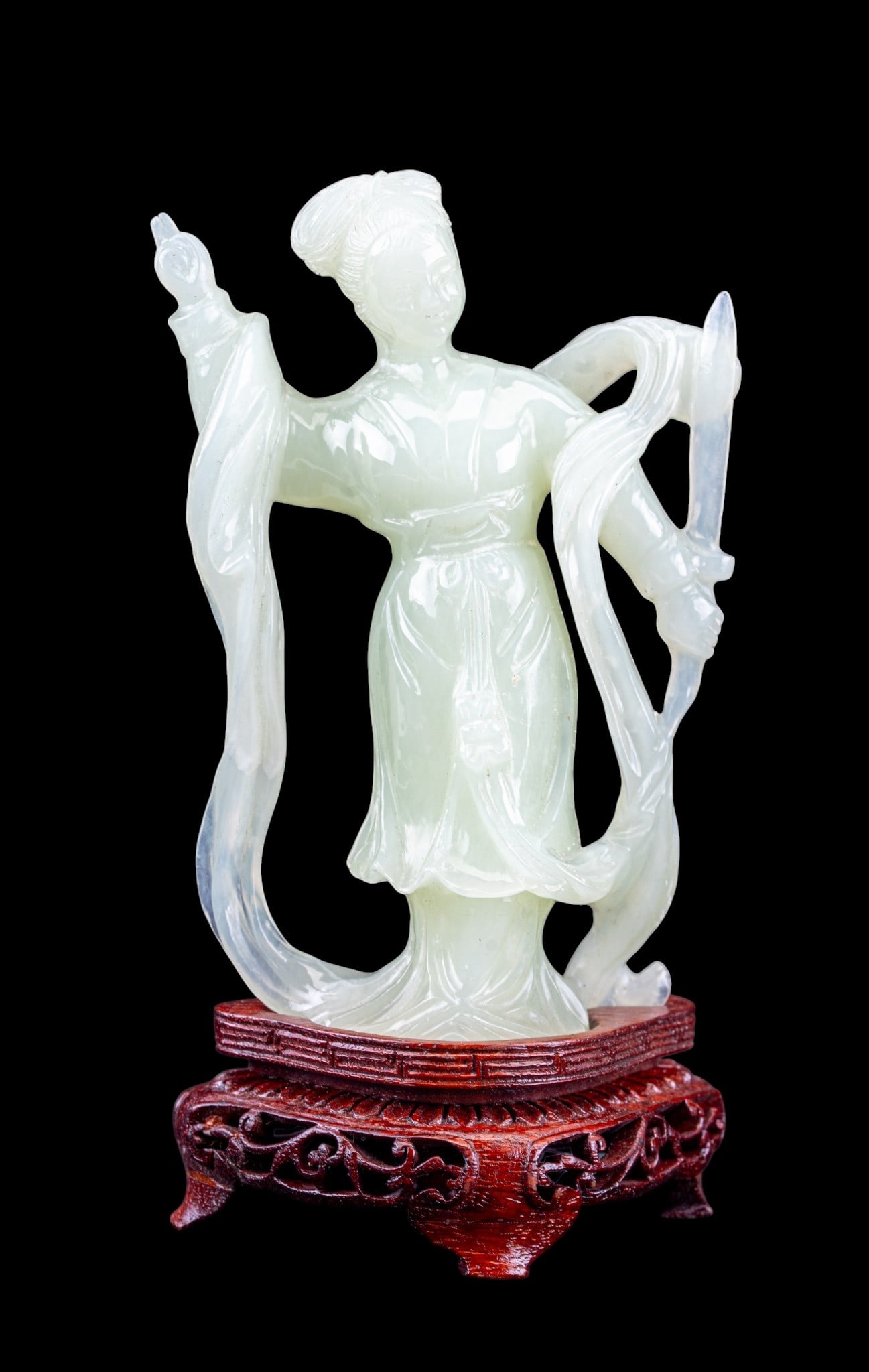 Vintage Chinese Jade Guanyin Figurine: A vintage carved Chinese jade figurine depicting Guanyin including a carved wooden base and custom silk box. Figurine measures approx. 6.5" H with the base. Bodhisattva.