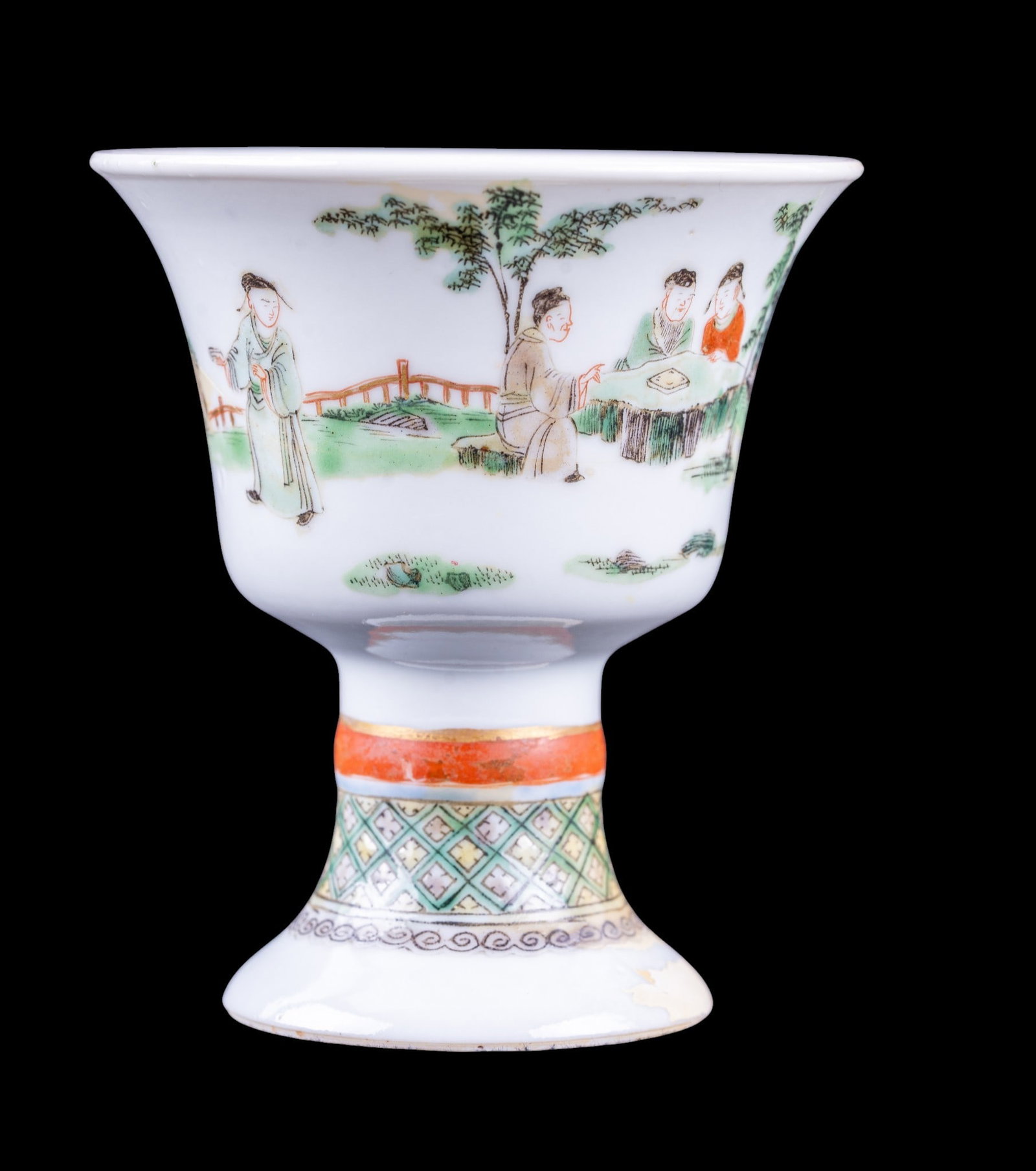 Chinese Famille Rose Footed Cup: Small Chinese famille rose porcelain stem cup, flared bowl enameled with continuous figural garden scene with elders. Raised on a pedestal foot decorated with iron-red and gilt bands. Underside bearin