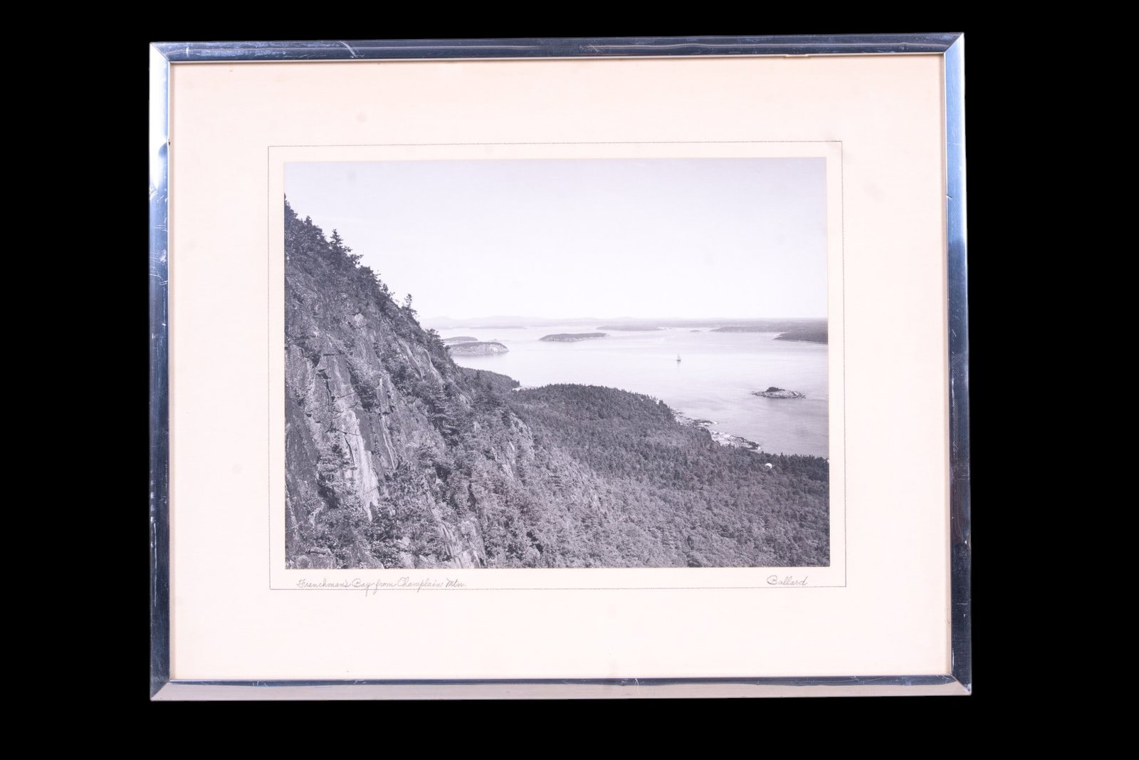 Signed Black & White Photo by Ballard: Framed and matted photo of Frenchman's Bay from Champlain Mountain, signed by Ballard. set in a chrome frame with ecru mat. Measures approx. 17" x 21"