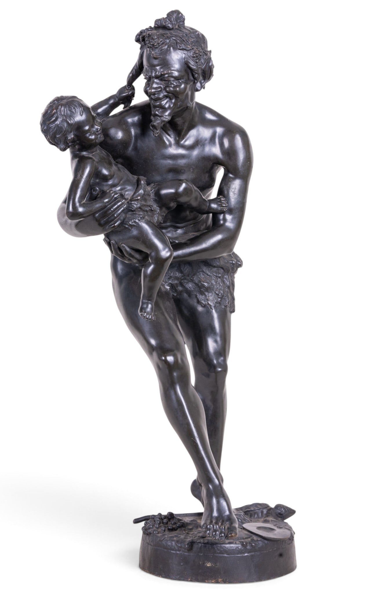 Large Bronze Faun and Child Sculpture, Thyllmant: Large bronze figural group depicting a faun or satyr holding a young child, modeled with wreath and accompanied by Bacchic attributed including grapes and cymbals incorporated into the naturalistic