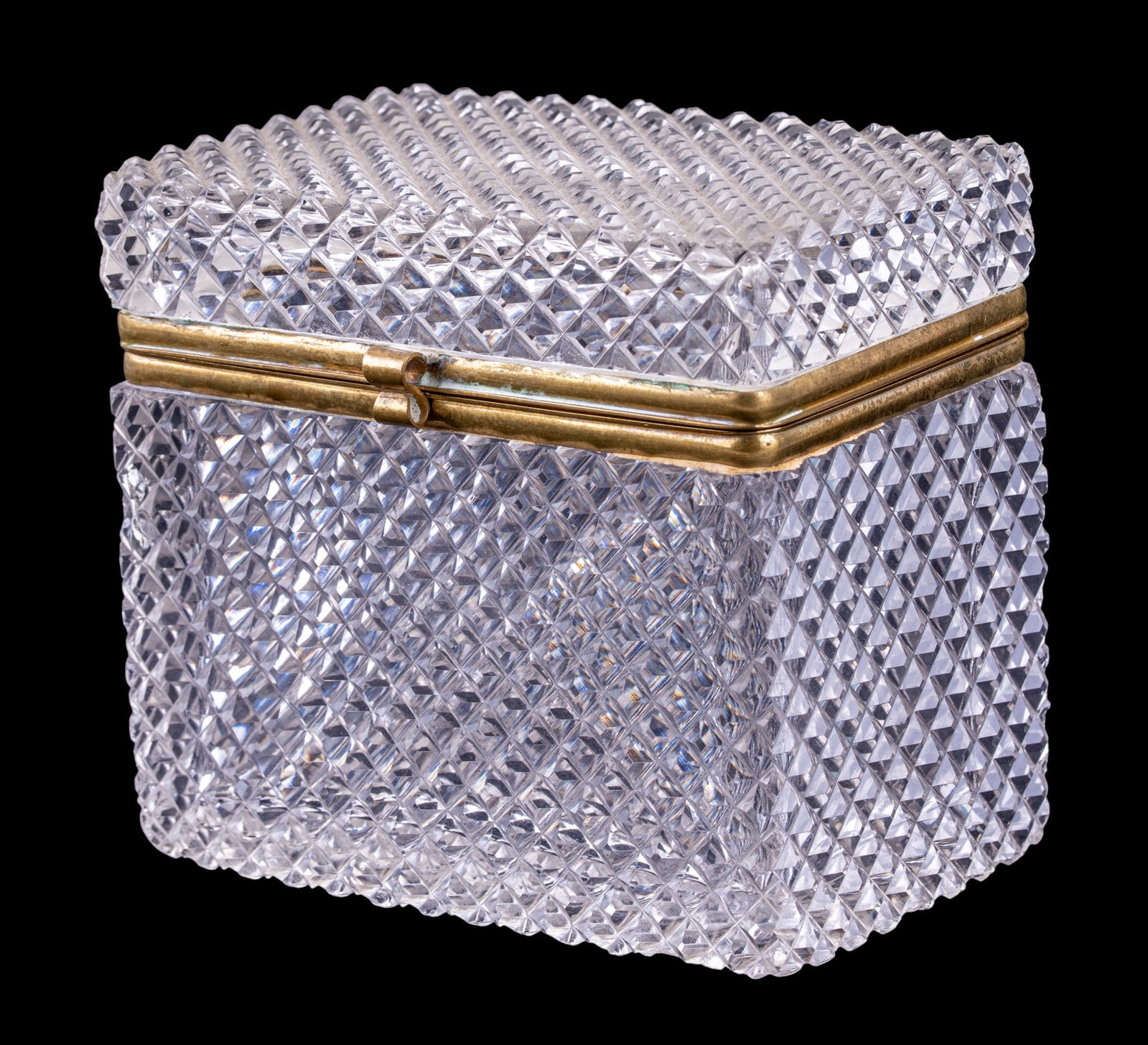Cut Crystal Jewlery Casket w/ Gilt Brass Mounts: Rectangular cut crystal jewlery casket or dresser box, heavily cut throughout in a repeating diamond-point pattern. Fitted with hinged gilt brass mounts, having an embossed foliate border to reverse. 