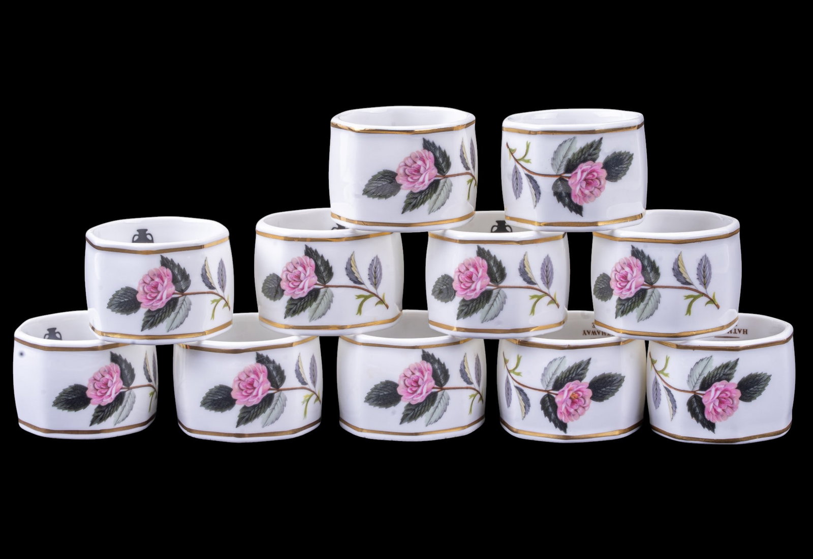 Set of 11 Wedgwood Hathaway Rose Napkin Rings: Set of 11 Wedgwood bone china napkin rings in the Hathaway Rose pattern, decorated with pink roses and foliage with gilt trim. Marked "Wedgwood Bone China, Made in England, Hathaway Rose. Each measure