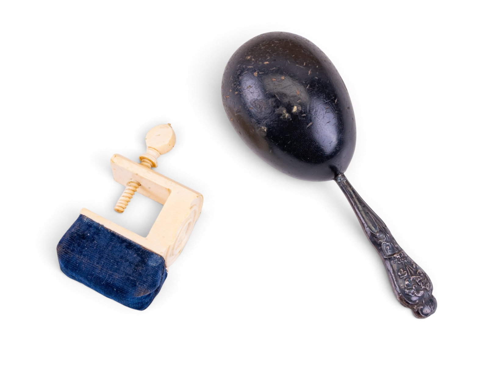 19th C Sewing Bird Pincushion, Darning Egg: Sewing implements including a 19th century sewing bird with attached pincushion measuring approximately 3 inches from bottom of the screw to top of the cushion, and a separate darning egg w/ SP handle