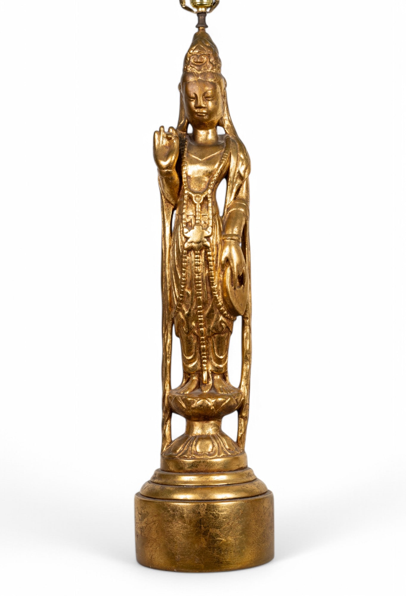 Guanyin Gold Tone Figural Ceramic Lamp: Figural gold tone ceramic standing Buddha table lamp depicting the Chinese Buddhist Goddess Guanyin / Guan Yin on a stylized lotus pedestal base. Tested, working condition but not guaranteed. Base to