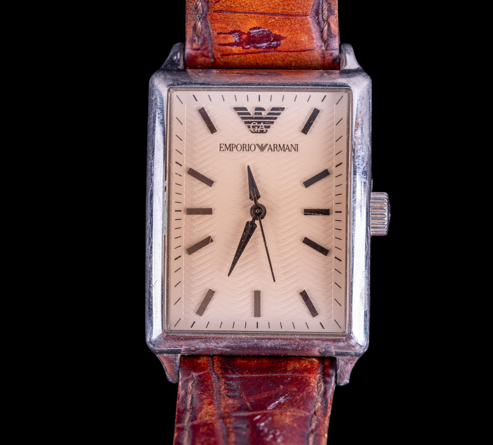 Armani Wristwatch: Emporio Armani stainless steal men's wristwatch on leather strap.