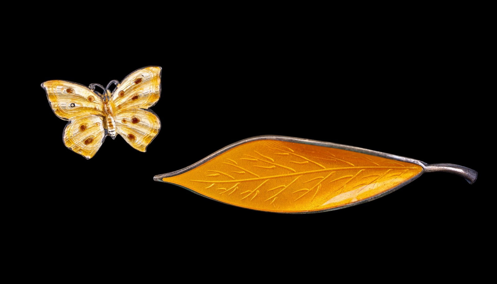 Sterling and Enamel Brooches: David Andersen Norway yellow enamel leaf brooch and a small sterling enamel butterfly.