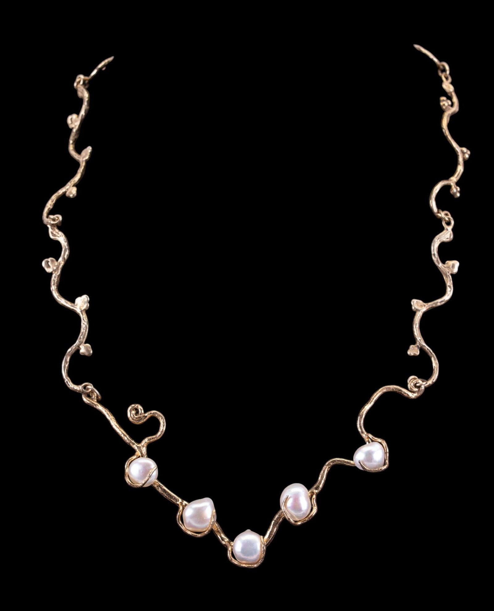 Pearl and Sterling Silver Necklace: Designer-style necklace set with white pearls; stamped .925.