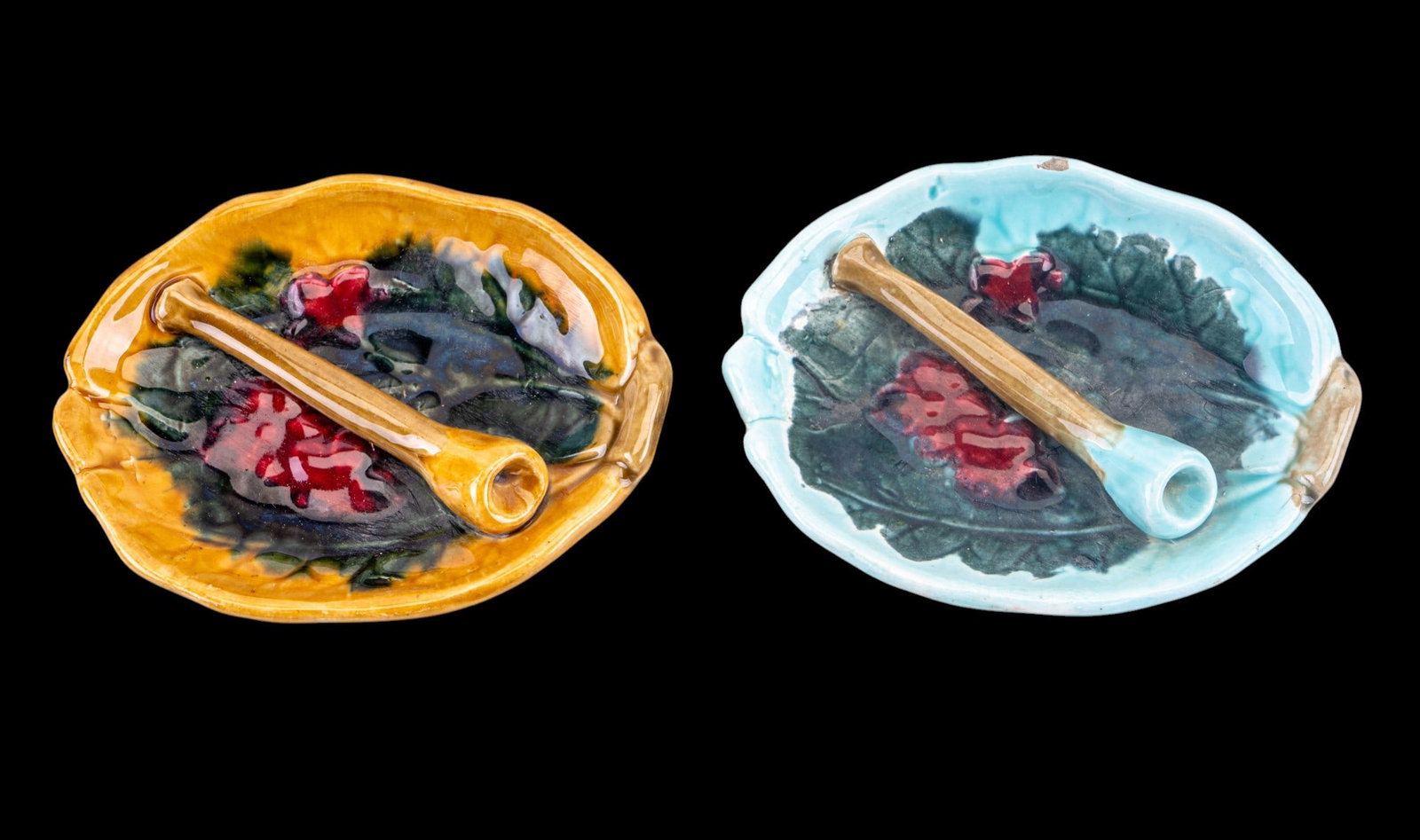 Vintage Ceramic Leaf Ashtrays: Two vintage ceramic ashtrays. Each ashtray is leaf-shaped and hand-painted, one in yellow and the other in turquoise. Both pieces have integrated cigarette rests and embossed Czechoslov marks on the