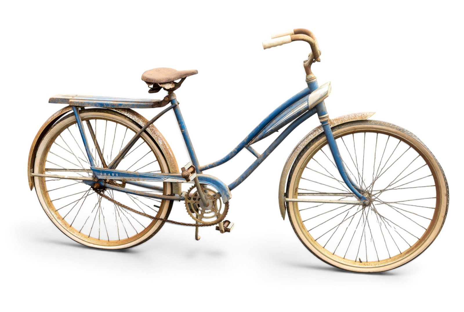 Blue Step-Through Frame Bicycle with Fenders: Step-through frame bicycle in blue with white and gold accents, original fenders, single-speed drivetrain, and rear rack. Features include a brown saddle, curved handlebars with white grips, and aged