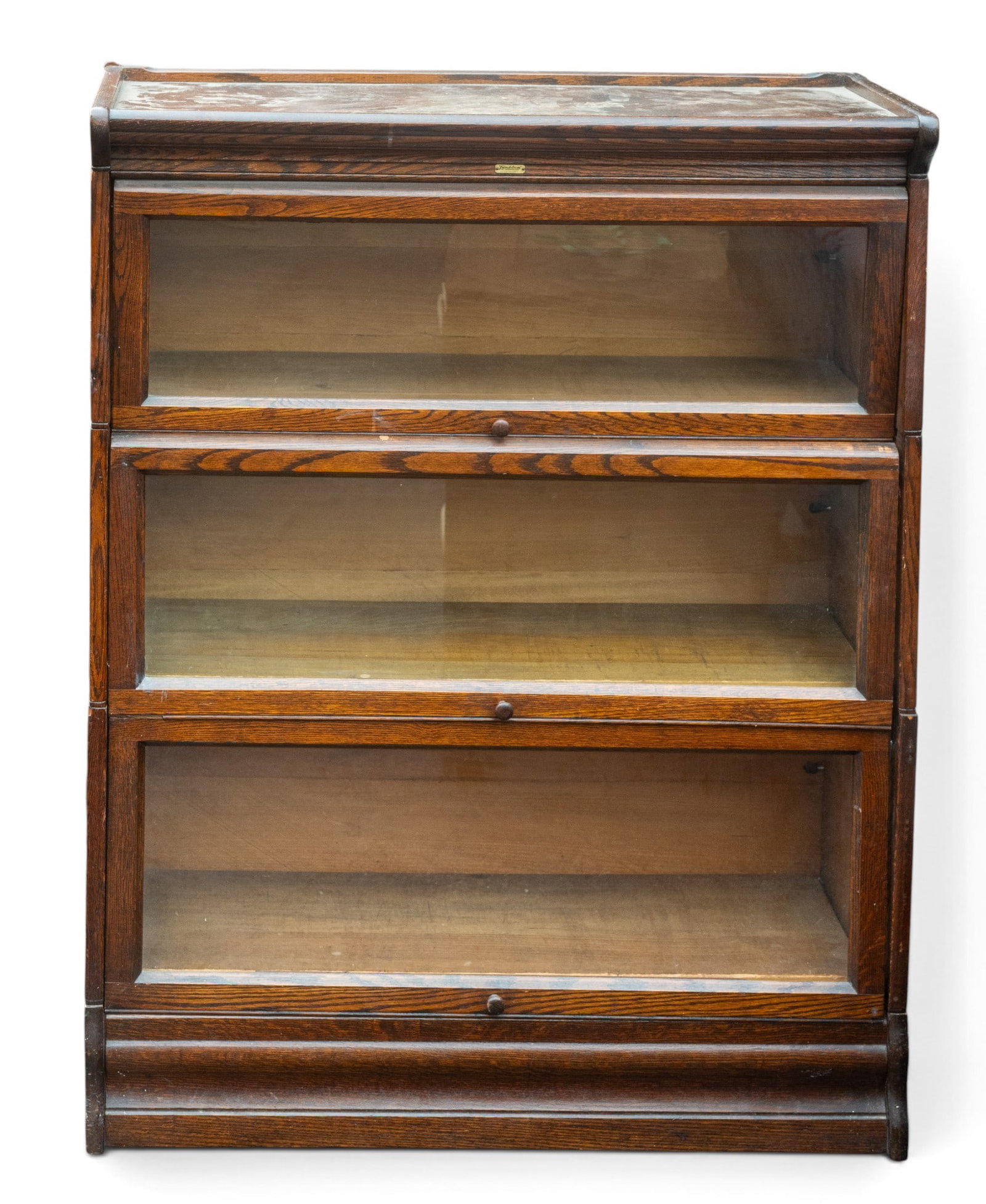 Lundstrom Sectional Barrister Bookcase: Lundstrom sectional barrister bookcase from Little Falls, NY, featuring glass front doors and wood construction. The bookcase measures 43 inches high, 33.5 inches wide, and 13 inches deep. Maker?s