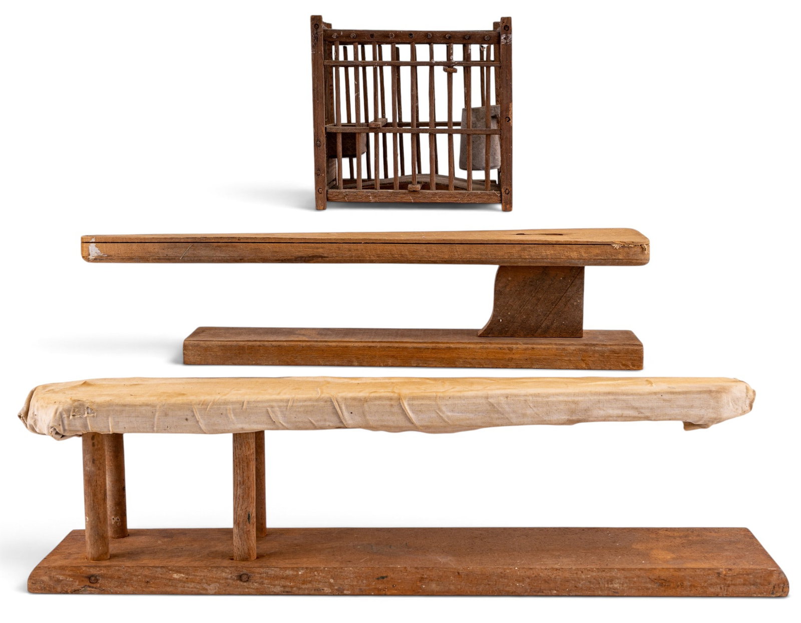 Sleeve Ironing Boards and Small Wood Cage: Two vintage wooden sleeve ironing boards on stands and a rustic handcrafted wooden model resembling a small cage or stable. Items show signs of age and previous use. Largest measures approximately