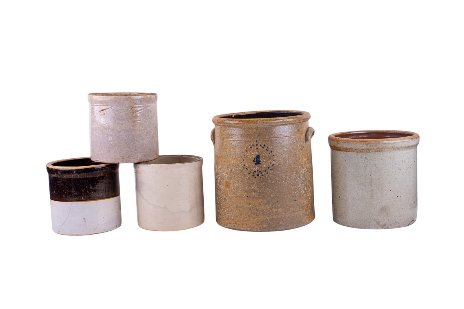 5 Stoneware Crocks, Largest 11 3/4" Tall: Five stoneware crocks in various sizes and glaze finishes. The largest crock measures approximately 11 3/4 inches tall and 11 inches in diameter. Includes blue and brown decorations and plain glazed p