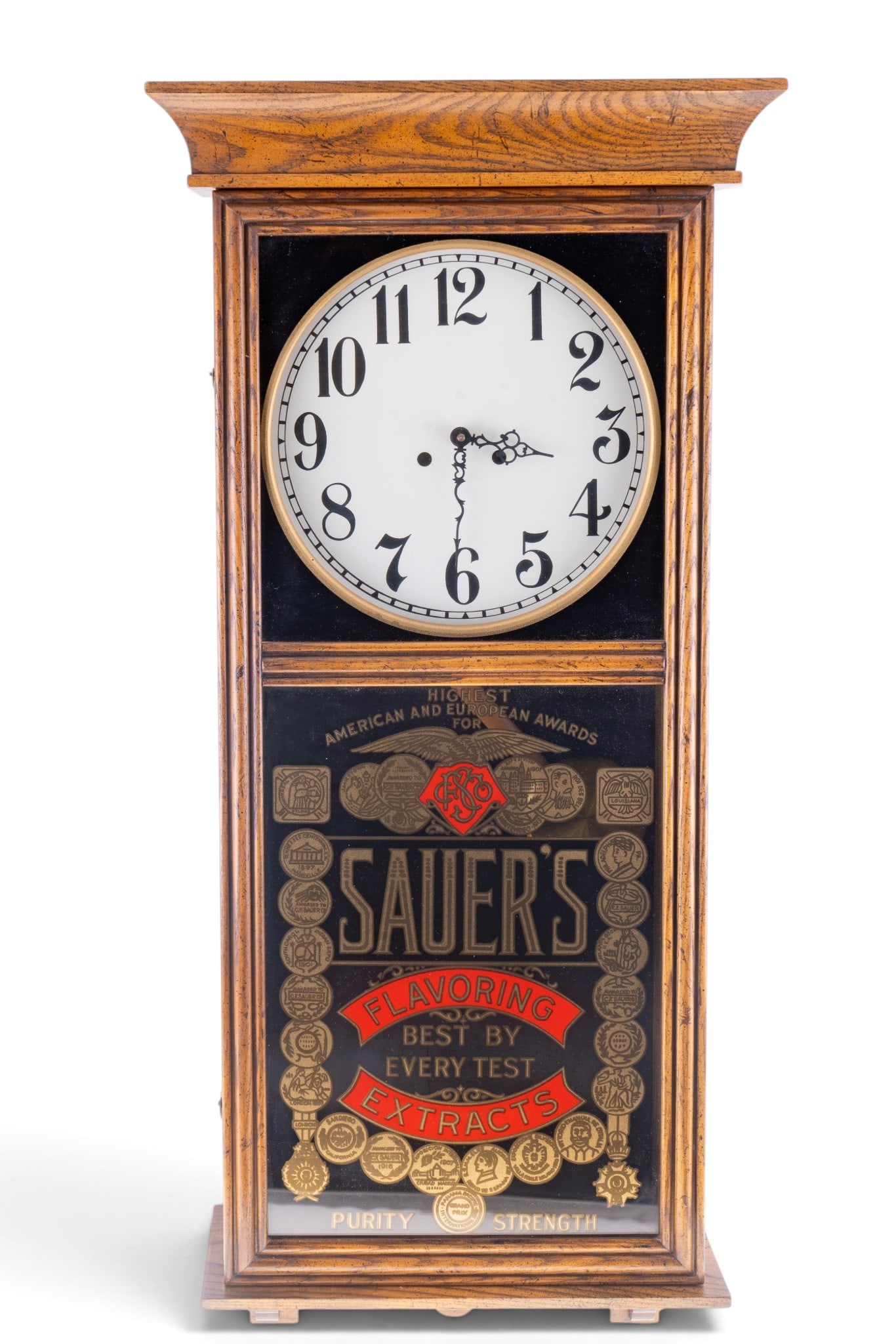 Sauer's Advertising Wall Clock with Key: Over 3' H Sauer's advertising wall clock includes a click key and features a glass front with gold-tone branding and awards illustrations. The clock measures approximately 40 inches by 14 inches,