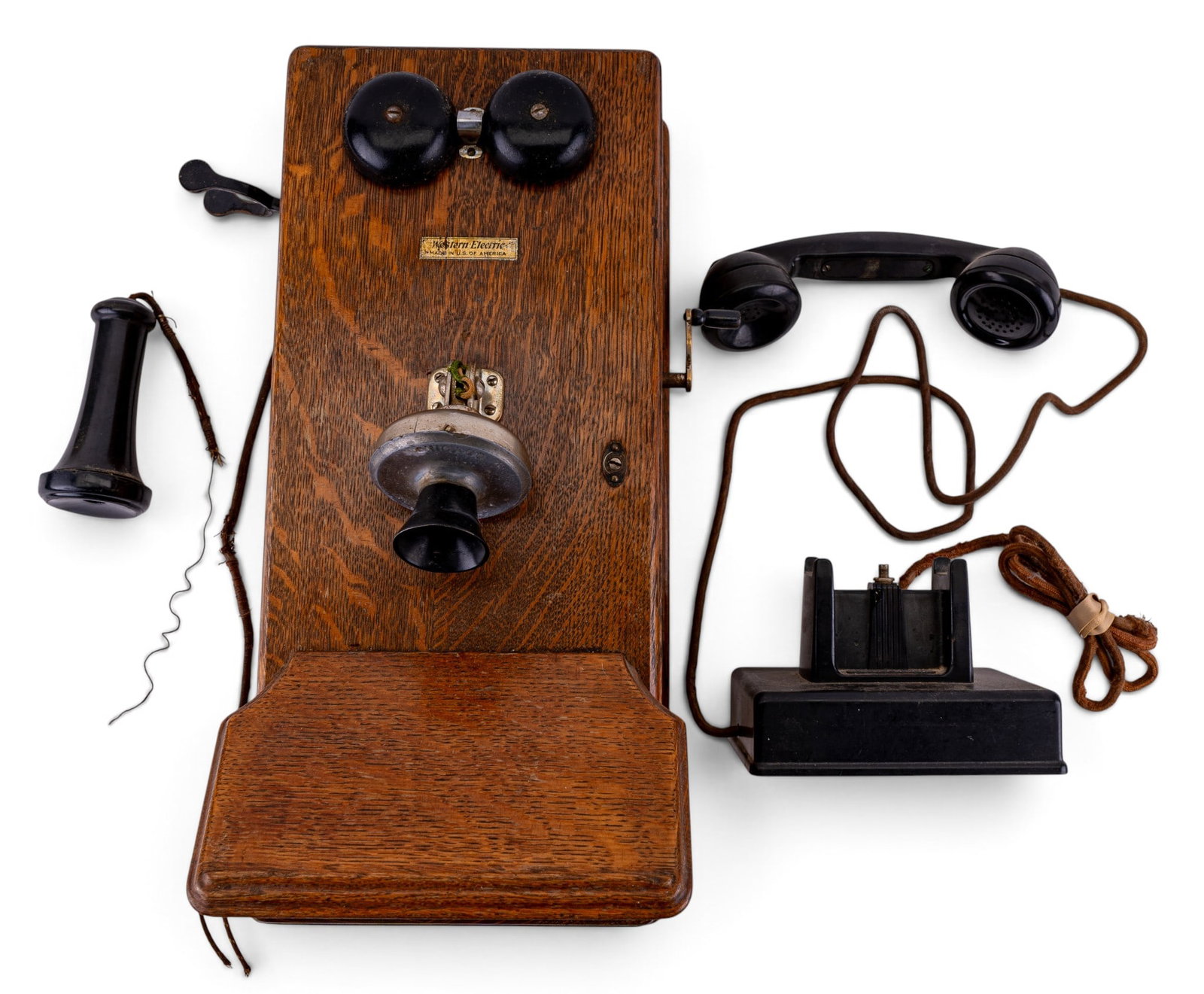 Early Golden Oak WE Wall Mounted Phone: Early golden oak Western Electric wall-mounted phone, cord with some separation, inner workings present but not tested. Also included is another phone "Pictograph Phone", appears to be bakelite, not t