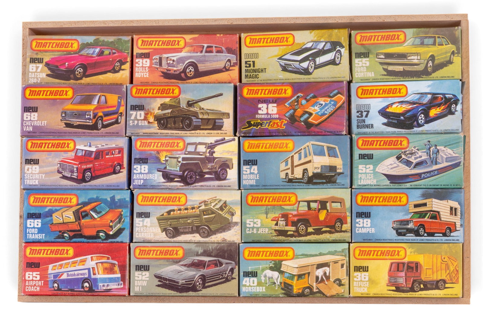 20 Vintage Matchbox Cars: 20 vintage Matchbox cars, housed in original boxes. Sold as found. Comes with wooden tray measuring approx. 2" H x 8.5" D x 13" W