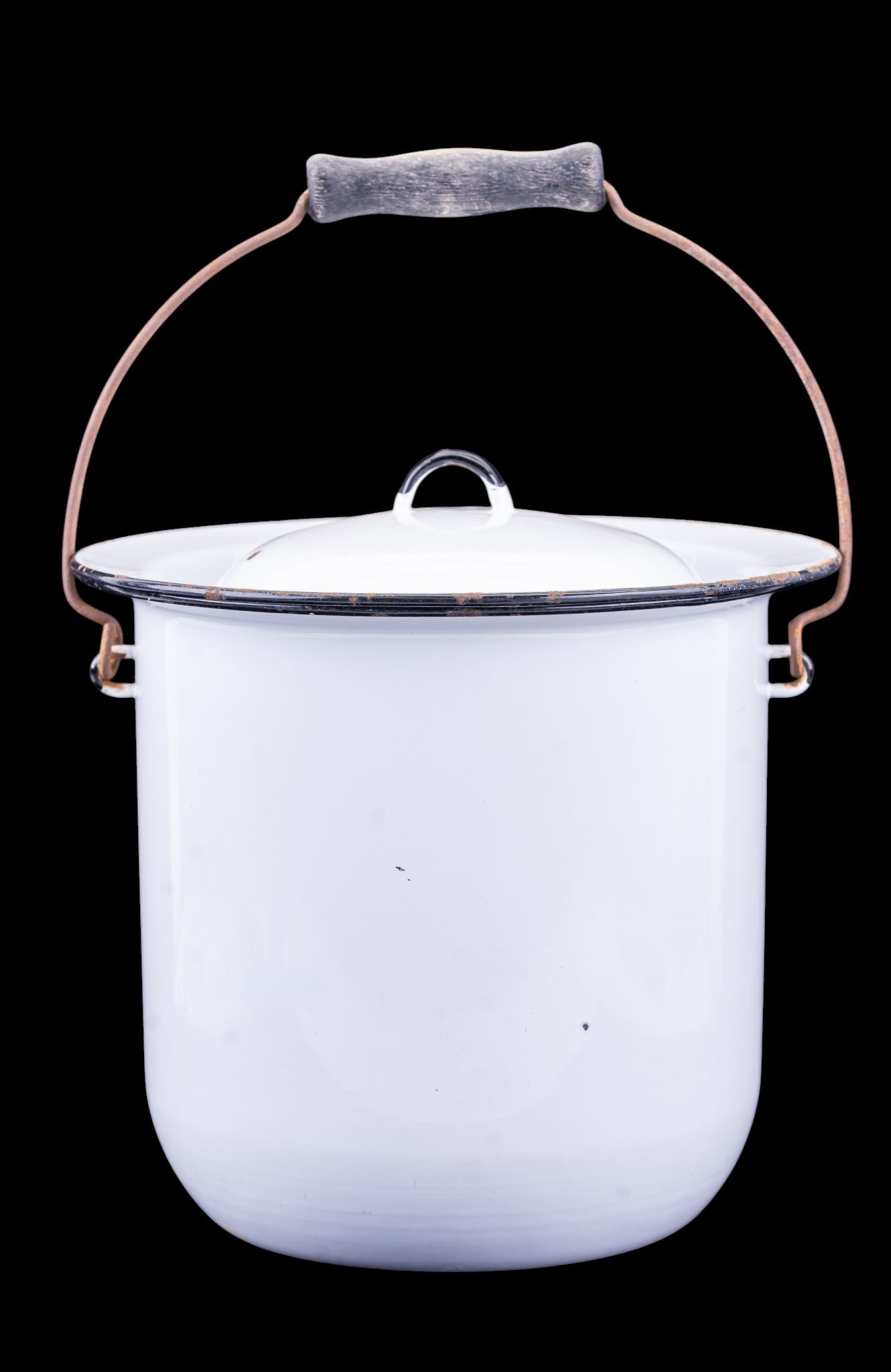 Large Lidded Metal Chamber Pot, 9.5 Inches High: White metal chamber pot with lid and a carrying handle, measuring approximately 9.5 inches high. Features black trim on the rim and handle with some wear and minor surface discoloration.