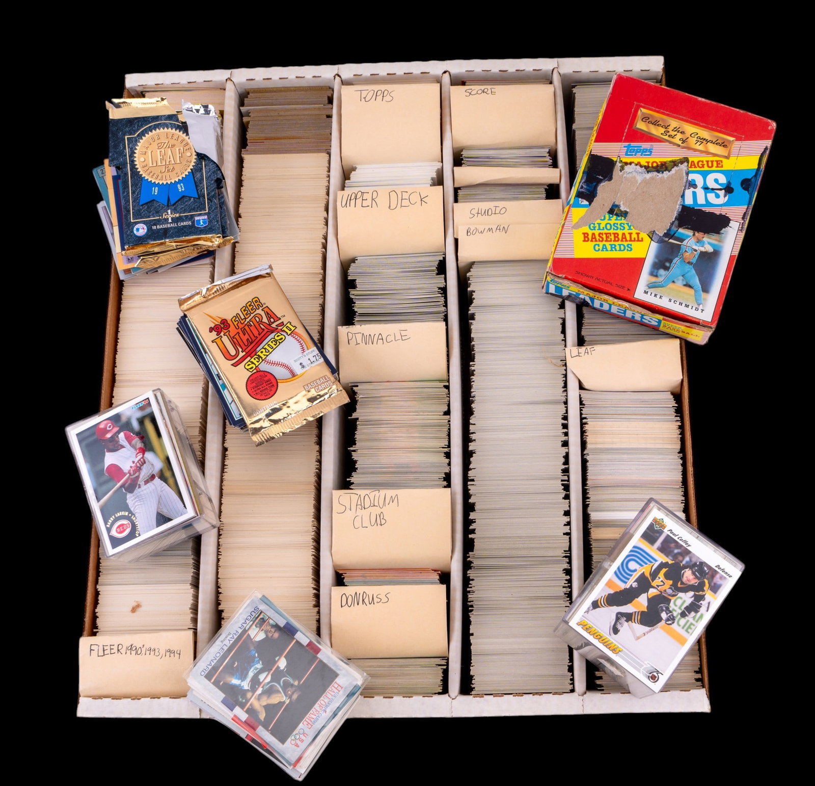 Baseball and Hockey Card Collection: Large assortment of baseball cards and a few hockey cards from brands including Topps, Fleer, Donruss, Upper Deck, Pinnacle, Score, Studio, Bowman, Stadium Club, and Leaf, featuring various years and 