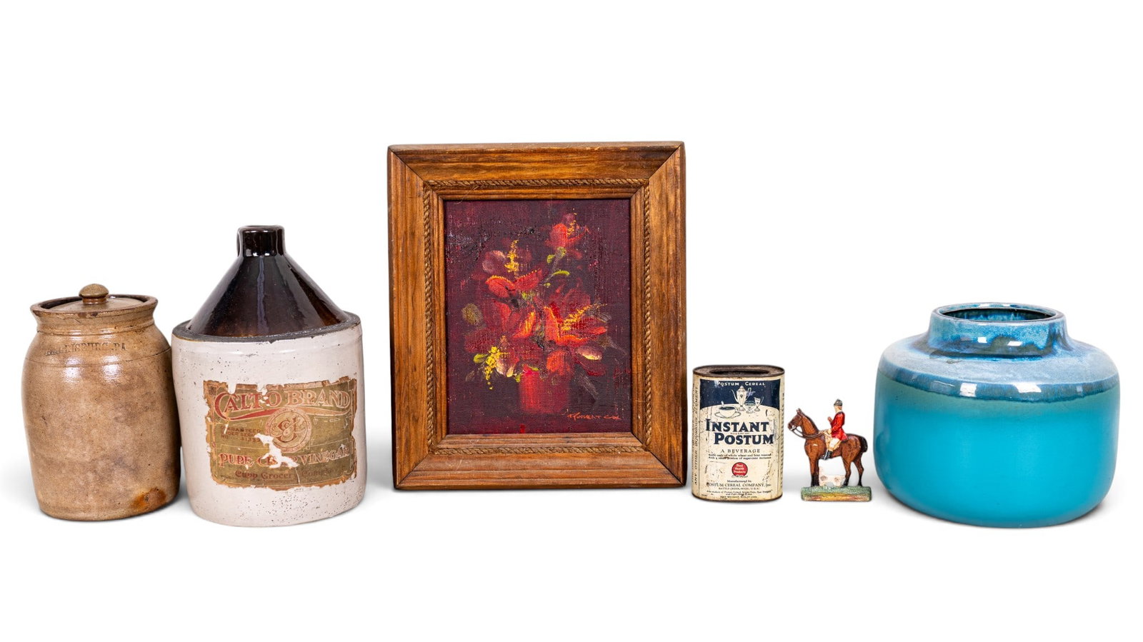Vintage Country Decor Items w/ Crockery: Vintage country decor featuring a brown stoneware jug with a handle, a stamped "Harrisburg, PA" lidded crock, a blue glazed pottery jar, an Instant Postum tin, a painted metal horse and rider figurine