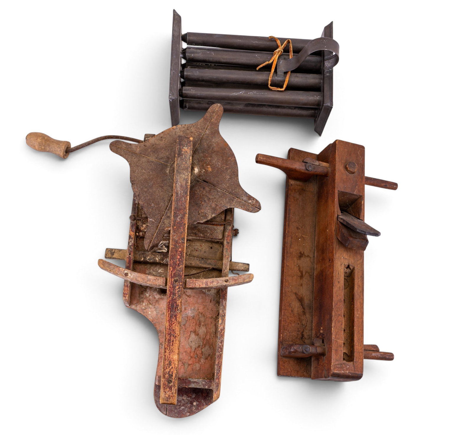 Antique Molding Plane, Hand Spreader & Candle Form: Antique wooden molding plane, a plain antique hand spreader, and a later metal eight mold candle form on stand. The candle form has eight cylindrical molds in a rectangular frame and measures