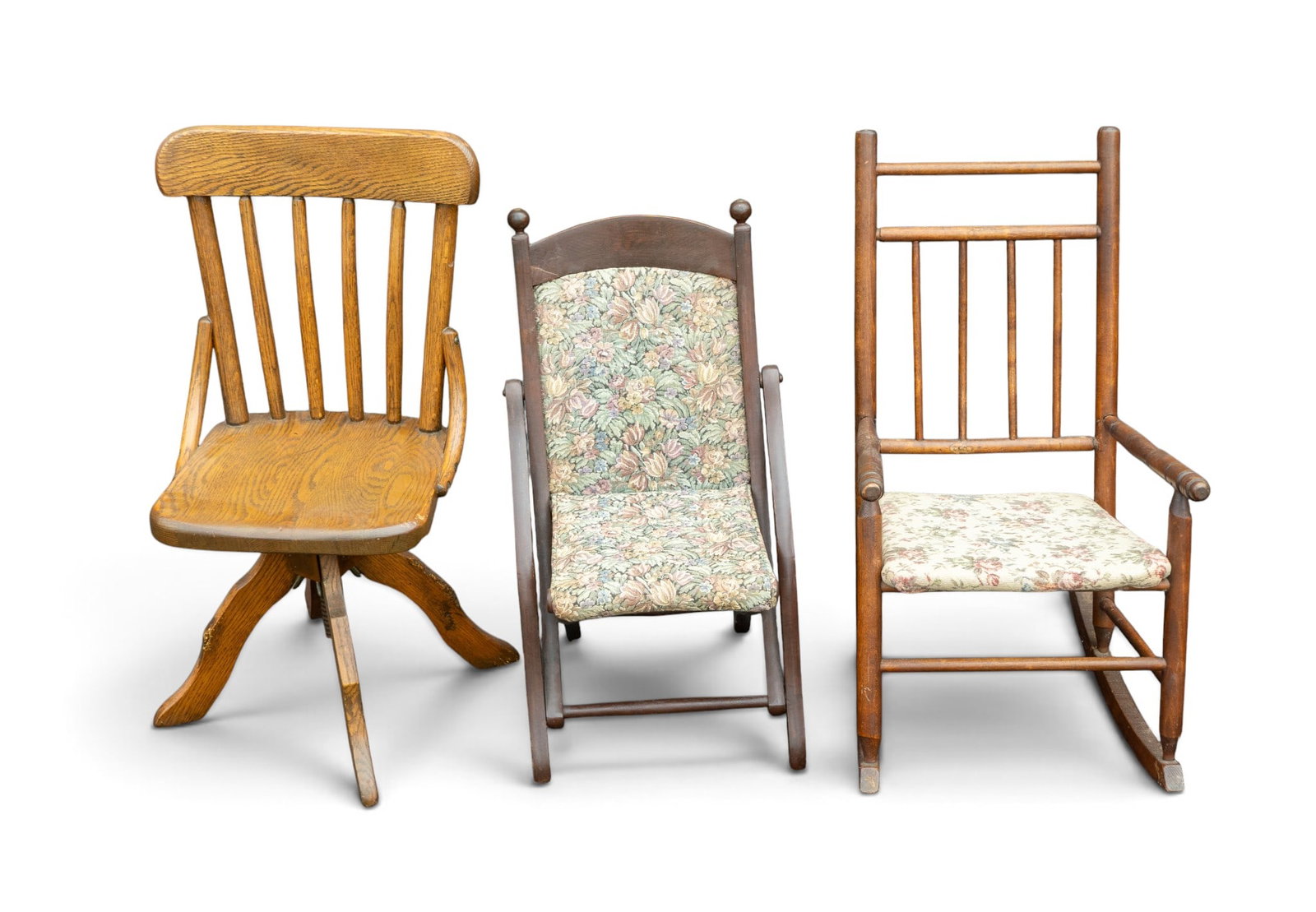Antique and Early Children's Chairs (3): collection of three antique and early children's chairs including an oak rising swivel chair by the Paris MFG Co model No. 20, approx. 17" w x 17" D x 25" H, a dark wood and carpet tapestry folding