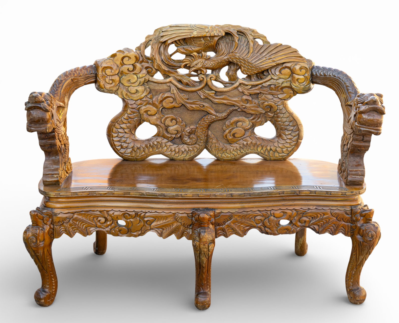 Antique Chinese Carved Settee: Antique Chinese carved settee with high-relief carving throughout, including a pierced backrest with dragon-form arm rests and a central crest with additional foliate carving. Measures approx. 40.5"
