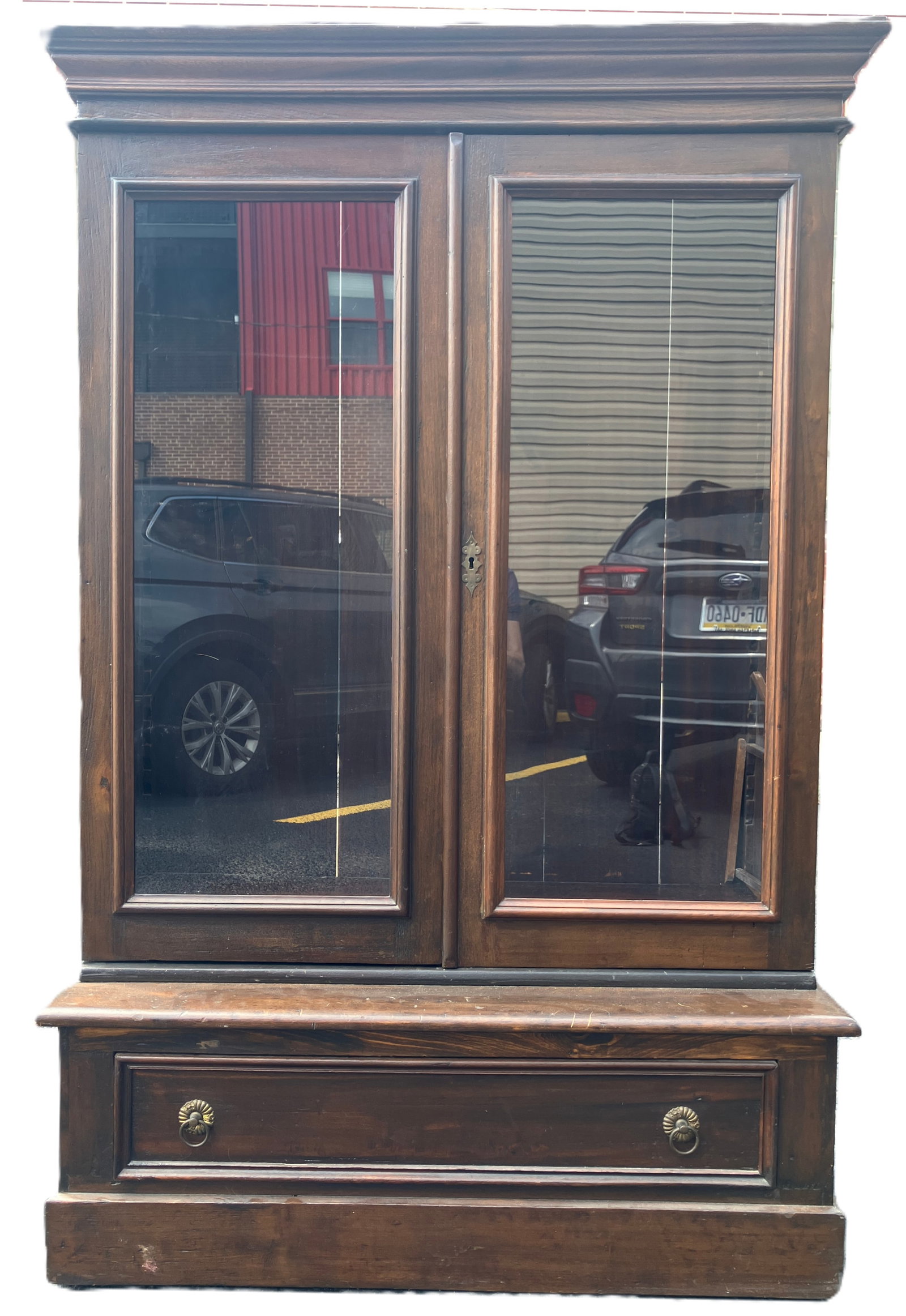 Vintage Bookcase w/ Gallery: Vintage wood bookcase with 2 glass doors over larger profile bottom drawer. Has locking mechanism but n key. Has gallery on top needing some restoration, pieces included. Single drawer with 2 pulls.