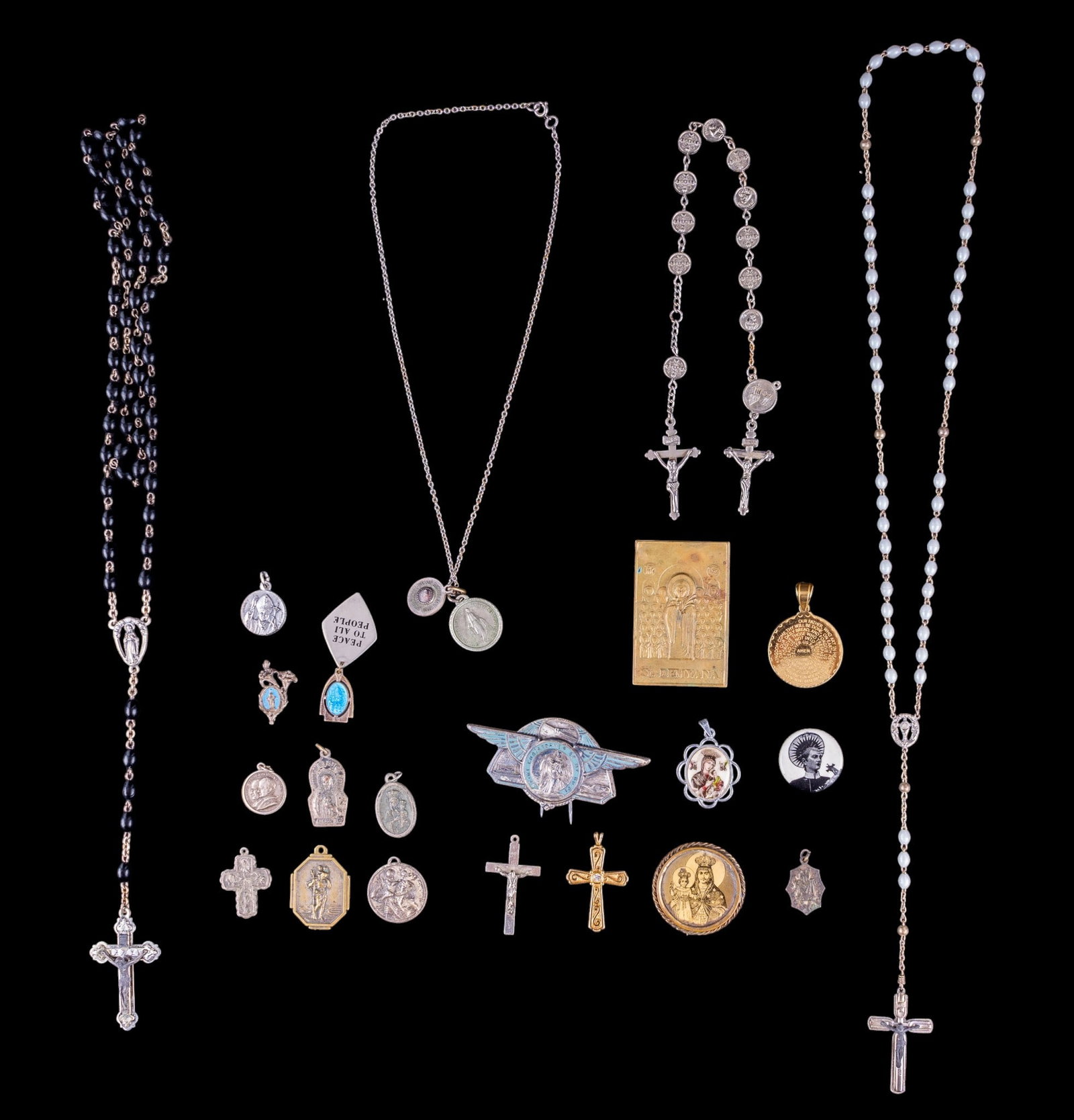 Rosaries and Religious Medallions: A collection of Rosaries, Cross pendants, prayer medallions, and pendants.
